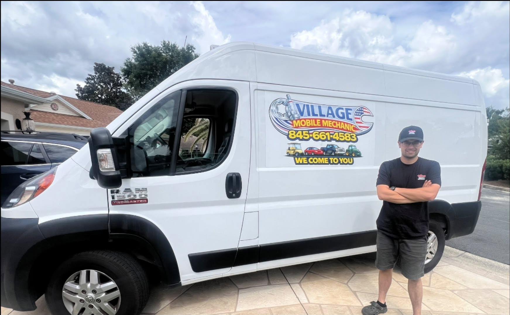 Village Mobile Mechanic owner standing beside his fully stocked service van in The Villages, Florida